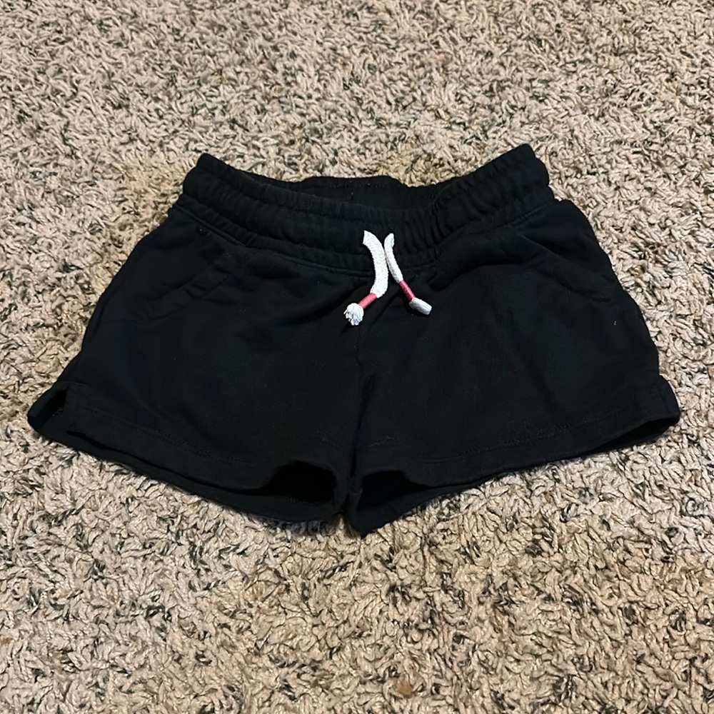 Girls black shorts with pink tie detail